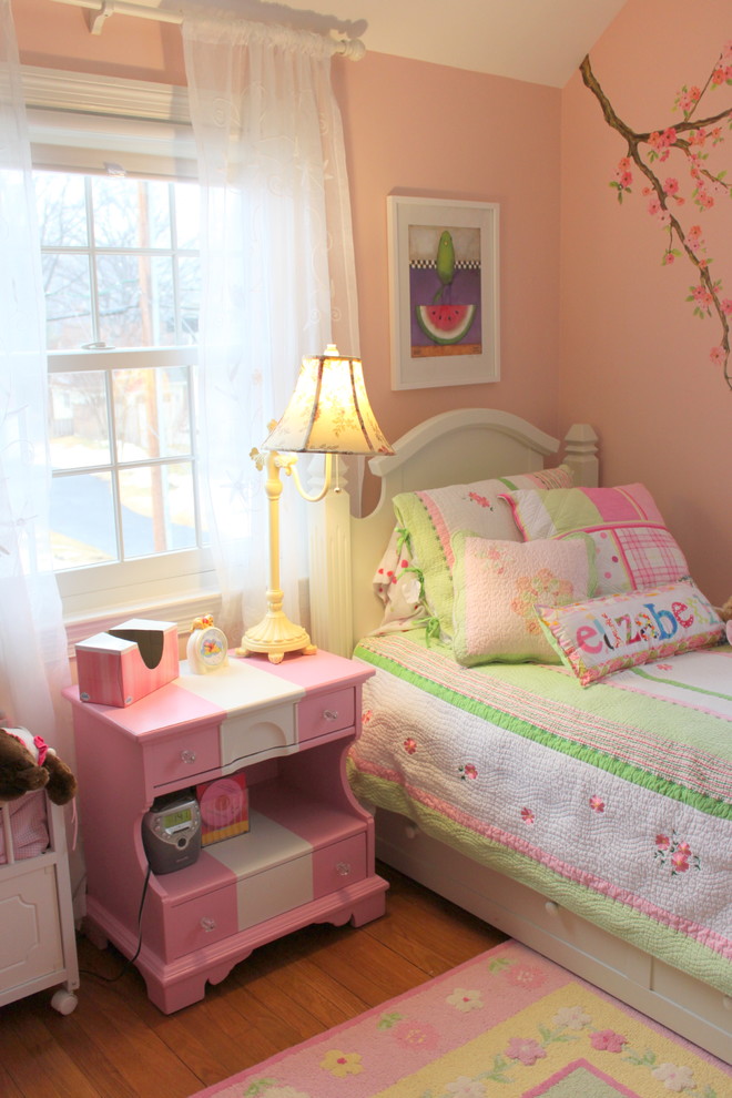This is an example of a traditional kids' room in DC Metro with pink walls.