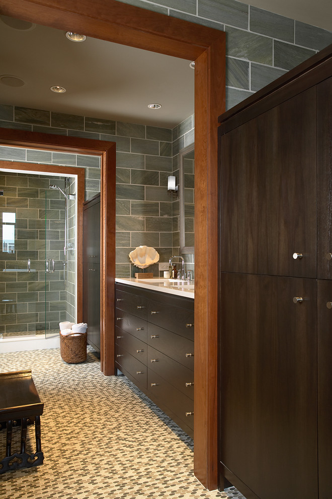 Photo of a contemporary master bathroom in Minneapolis with flat-panel cabinets, dark wood cabinets, green tile, an undermount sink, an alcove shower, green walls, mosaic tile floors, slate and white benchtops.