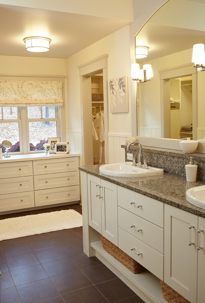 Photo of a country bathroom in Grand Rapids with a drop-in sink, shaker cabinets and yellow walls.