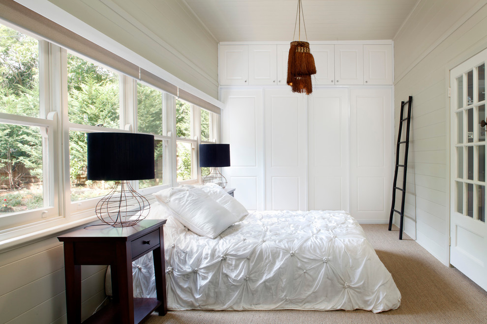Inspiration for a mid-sized traditional bedroom in Sydney with beige walls, carpet, no fireplace and beige floor.