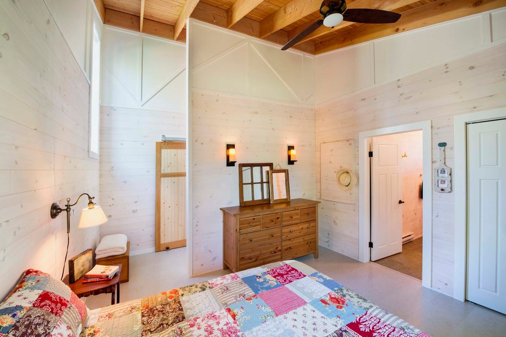 Inspiration for a mid-sized rustic guest bedroom remodel with beige walls and no fireplace