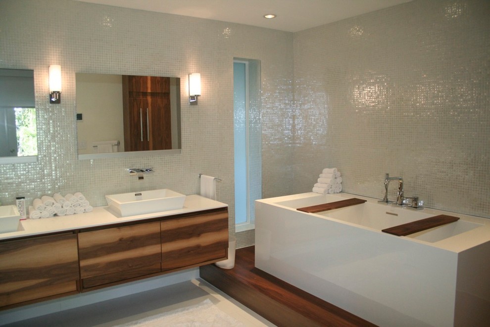 Mid-sized modern master bathroom in Miami with flat-panel cabinets, medium wood cabinets, a freestanding tub, a corner shower, multi-coloured walls, porcelain floors and a vessel sink.