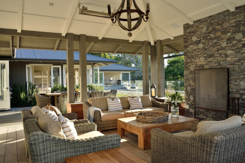 Inspiration for a country backyard verandah in Napier-Hastings with a fire feature, decking and a roof extension.