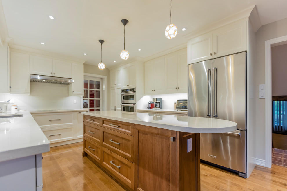 Example of a transitional kitchen design in Toronto