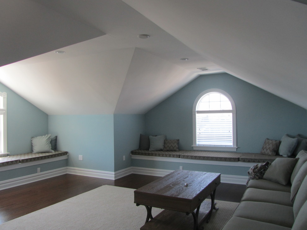 This is an example of a large beach style loft-style family room in Philadelphia with a game room, blue walls, dark hardwood floors, no fireplace and a wall-mounted tv.