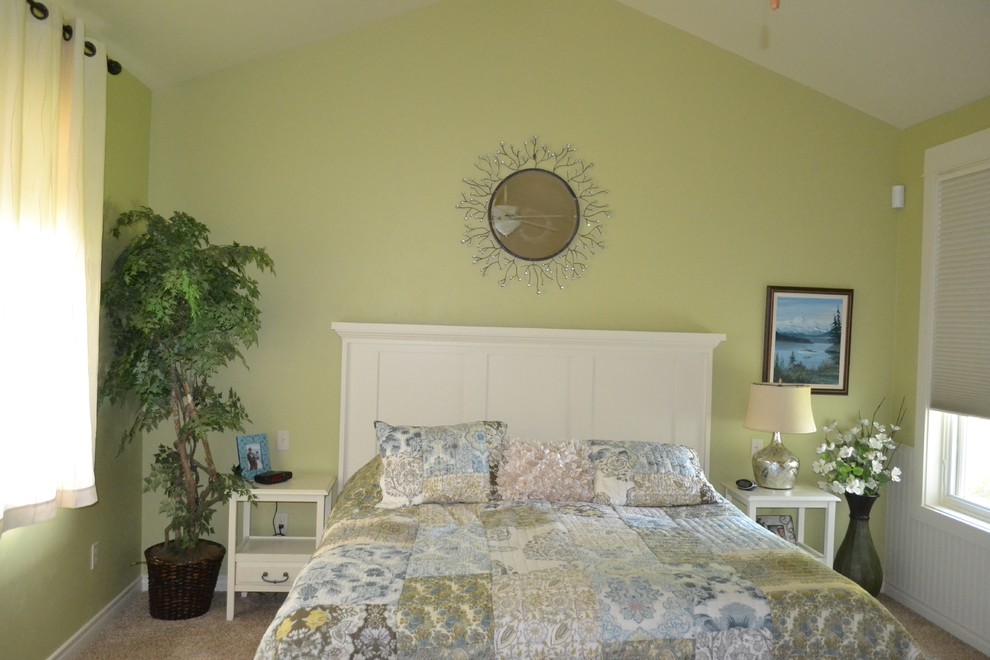 Inspiration for a mid-sized beach style master bedroom in Other with green walls and carpet.