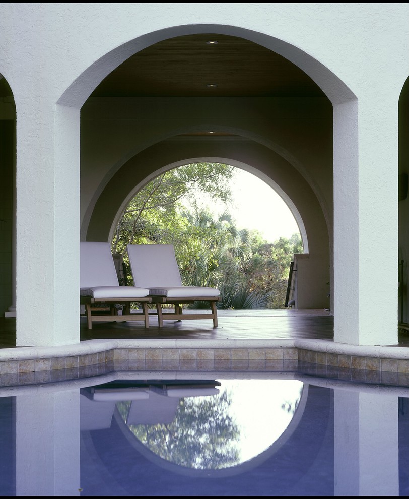 Inspiration for a mediterranean patio in Charleston with a roof extension.