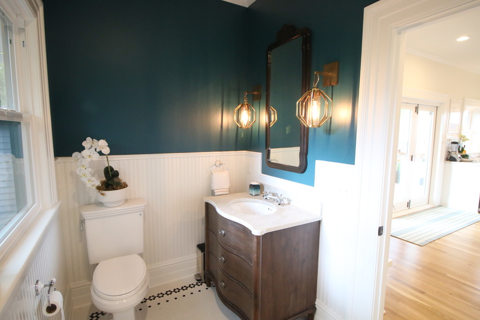 This is an example of a midcentury powder room in Portland.