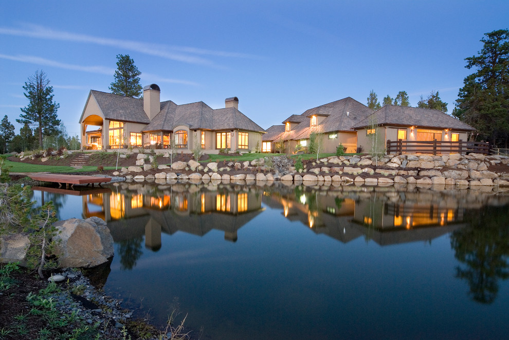Mountain style two-story stone exterior home photo