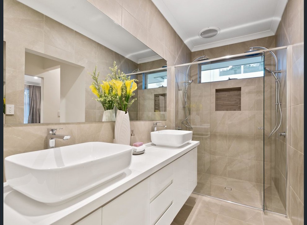 Mid-sized modern master bathroom in Perth with flat-panel cabinets, white cabinets, a double shower, beige tile, ceramic tile, ceramic floors, a vessel sink, engineered quartz benchtops, beige floor and a hinged shower door.