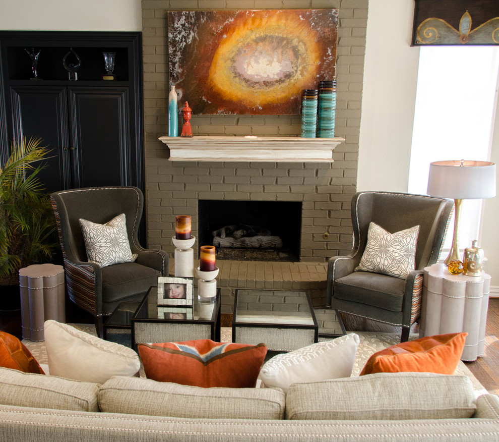 Photo of an eclectic family room in Dallas with a standard fireplace and a brick fireplace surround.