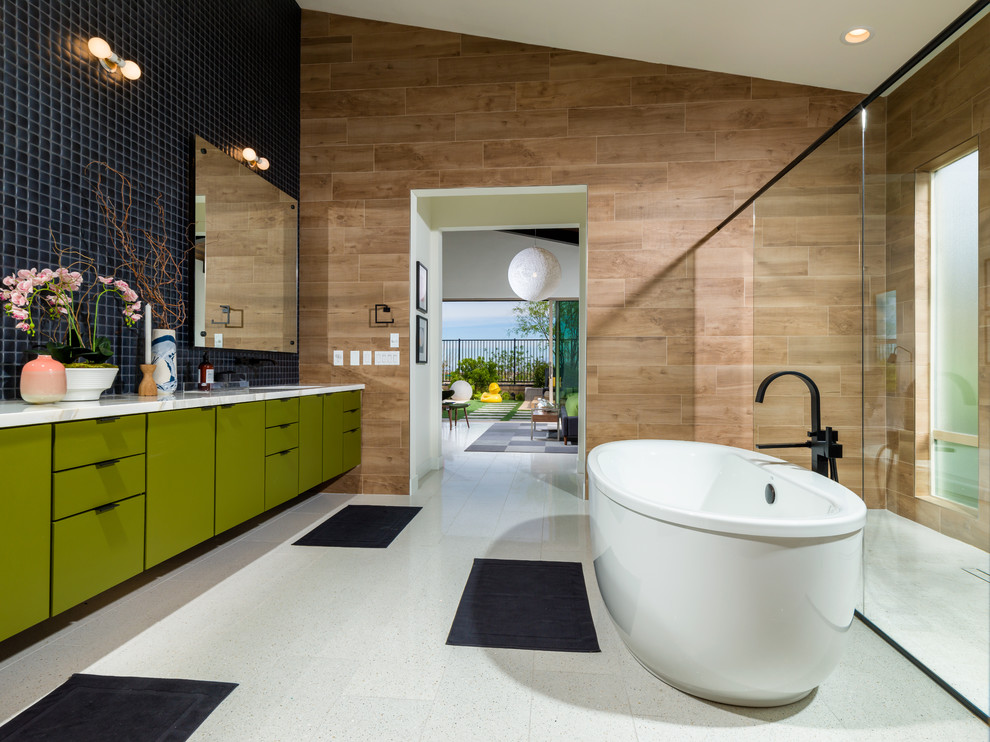 Design ideas for a mid-sized midcentury master bathroom in Los Angeles with flat-panel cabinets, green cabinets, a freestanding tub, a curbless shower, a one-piece toilet, black tile, ceramic tile, brown walls, an undermount sink, marble benchtops and an open shower.