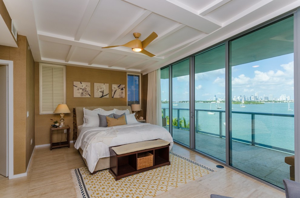 This is an example of a mid-sized transitional master bedroom in Miami with beige walls and ceramic floors.