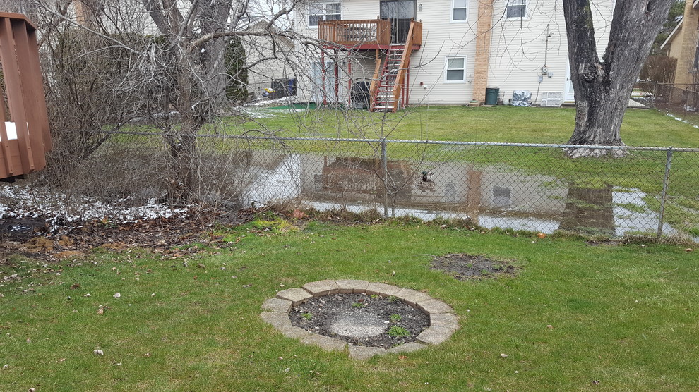 French drain across center of sloped yard to help with mud/drainage?