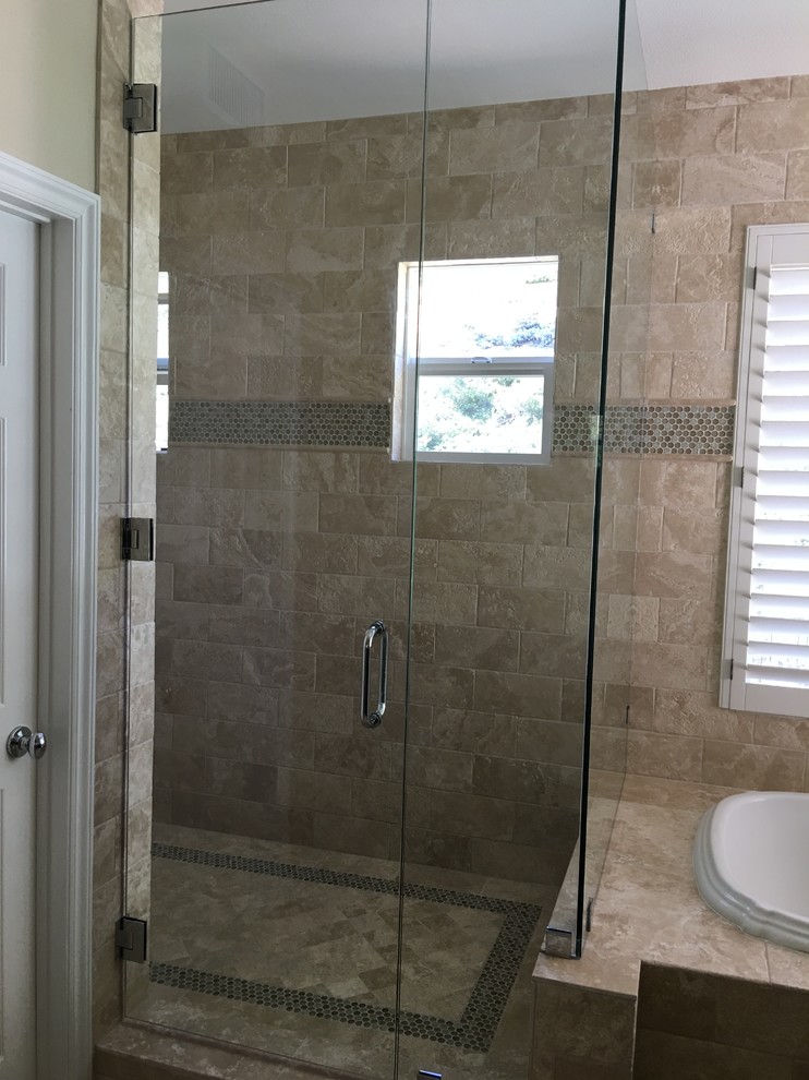 Bathroom - mid-sized traditional master beige tile and stone tile travertine floor bathroom idea in Los Angeles with flat-panel cabinets, dark wood cabinets, a one-piece toilet, beige walls, a drop-in sink and granite countertops