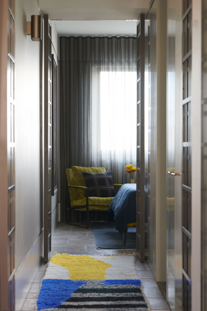 Mid-sized eclectic hallway in Sydney with beige walls, travertine floors, grey floor and decorative wall panelling.
