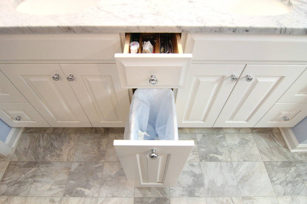 Mid-sized transitional master gray tile and porcelain tile linoleum floor home design photo with an undermount sink, raised-panel cabinets, white cabinets, marble countertops, a two-piece toilet and purple walls