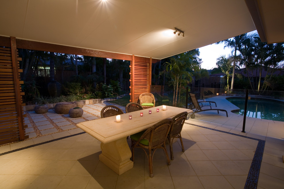 This is an example of a tropical patio in Sunshine Coast.