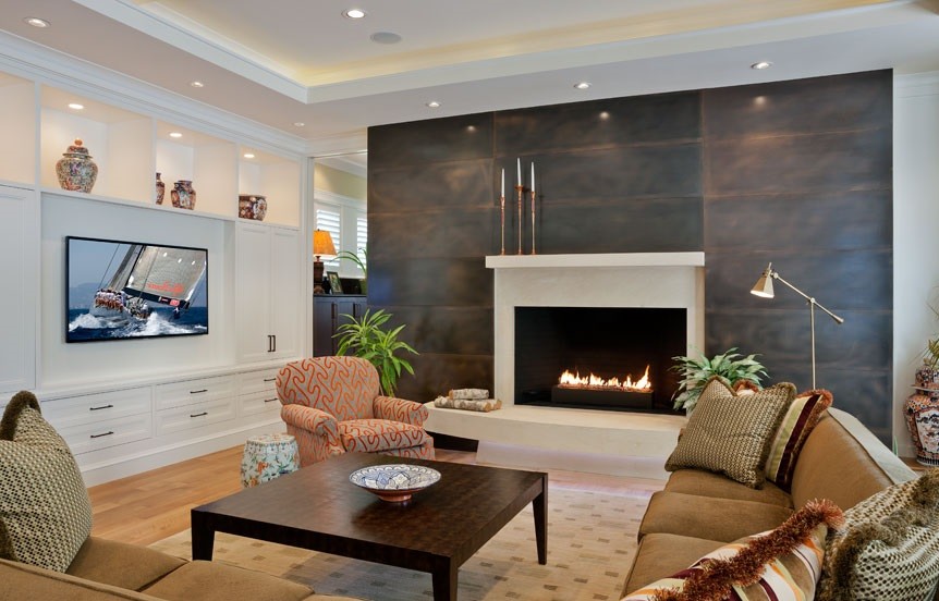 Mid-sized transitional formal enclosed living room in Boston with white walls, light hardwood floors, a standard fireplace, a metal fireplace surround and a built-in media wall.