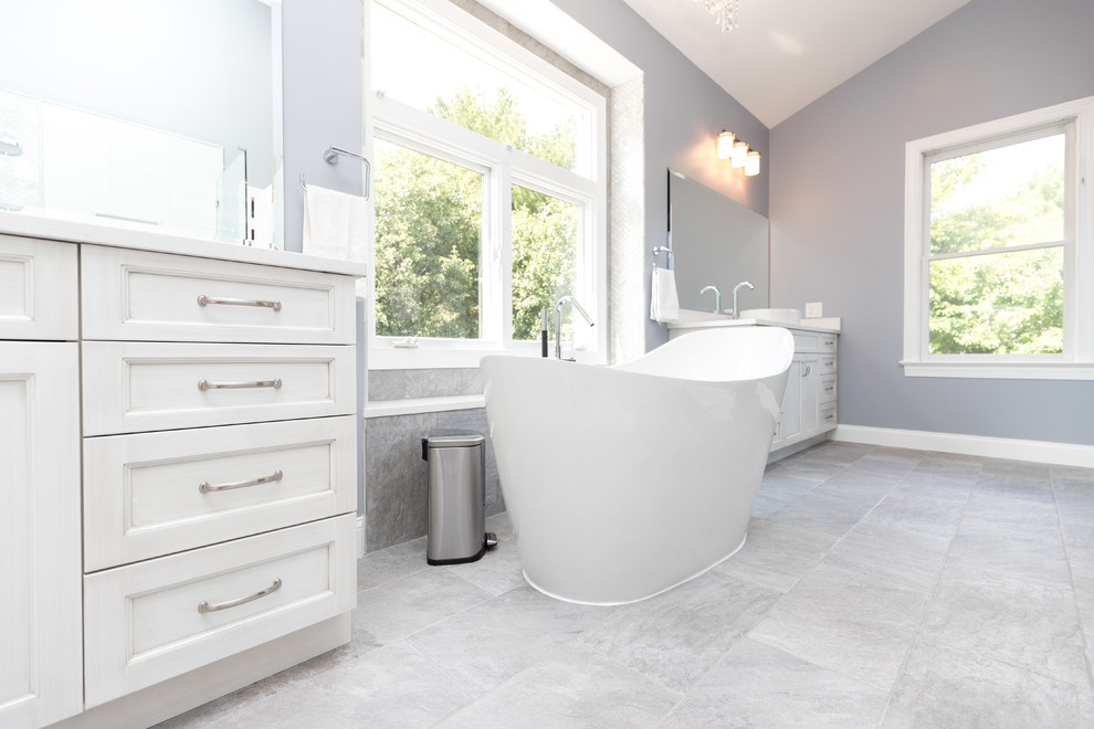 Inspiration for a large transitional master bathroom in DC Metro with shaker cabinets, white cabinets, a freestanding tub, an alcove shower, a two-piece toilet, white tile, porcelain tile, grey walls, slate floors, a vessel sink and engineered quartz benchtops.