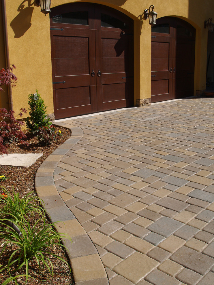 Inspiration for a mid-sized mediterranean courtyard driveway in San Francisco with concrete pavers.