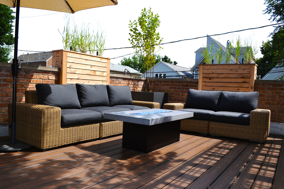 Design ideas for a small transitional rooftop deck in Chicago with a fire feature and a pergola.