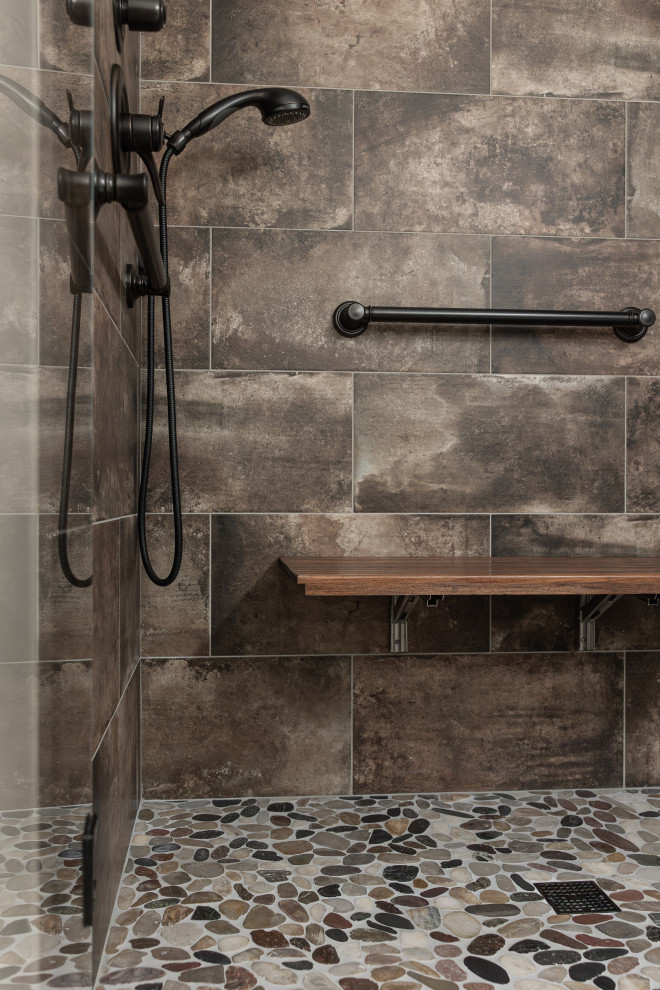 This is an example of a large midcentury master bathroom in Portland with flat-panel cabinets, light wood cabinets, brown tile, an undermount sink, granite benchtops, brown floor, brown benchtops, a double vanity and a built-in vanity.