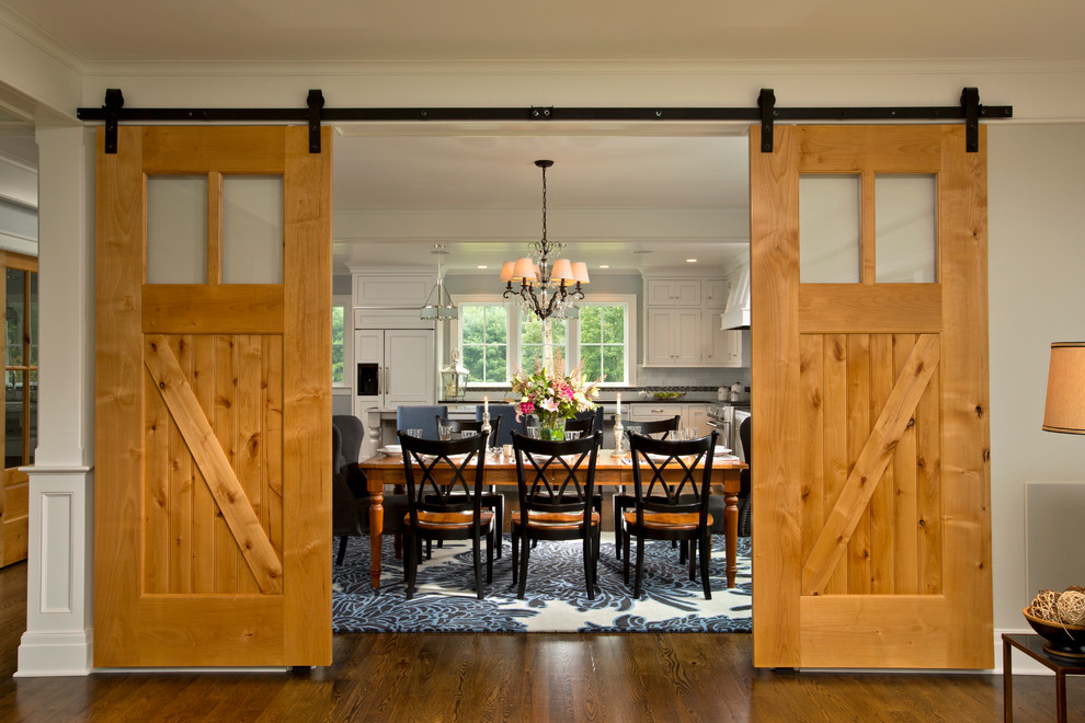 Design ideas for an expansive country kitchen/dining combo in Boston with grey walls and medium hardwood floors.