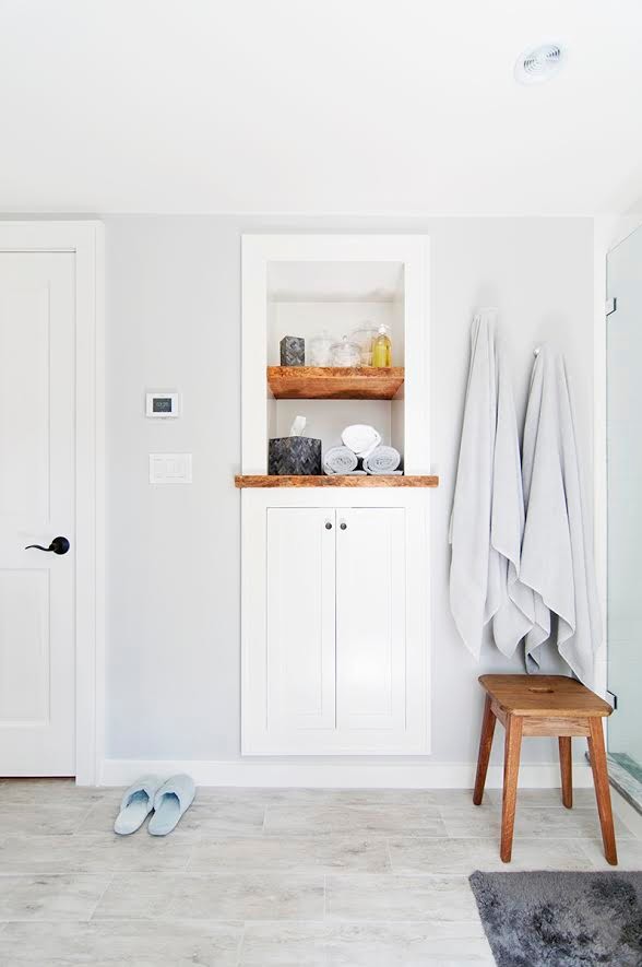 Alcove shower - large transitional master white tile and subway tile ceramic tile and gray floor alcove shower idea in Boston with recessed-panel cabinets, white cabinets, gray walls, an undermount sink, laminate countertops and a hinged shower door