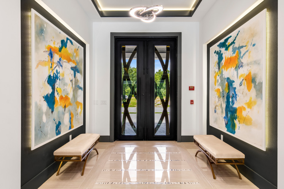 This is an example of a mid-sized contemporary foyer in Orlando with white walls, porcelain floors, a double front door and a black front door.