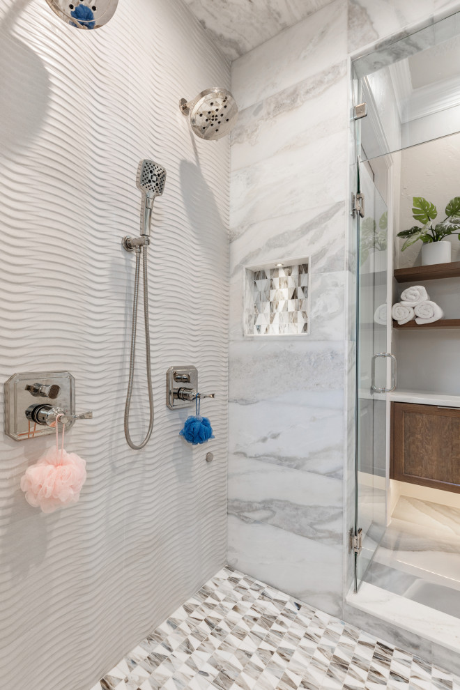 This is an example of an expansive modern master bathroom in Dallas with shaker cabinets, medium wood cabinets, a freestanding tub, a double shower, white tile, porcelain tile, grey walls, porcelain floors, a vessel sink, quartzite benchtops, blue floor, a hinged shower door, white benchtops, a shower seat, a double vanity and a floating vanity.