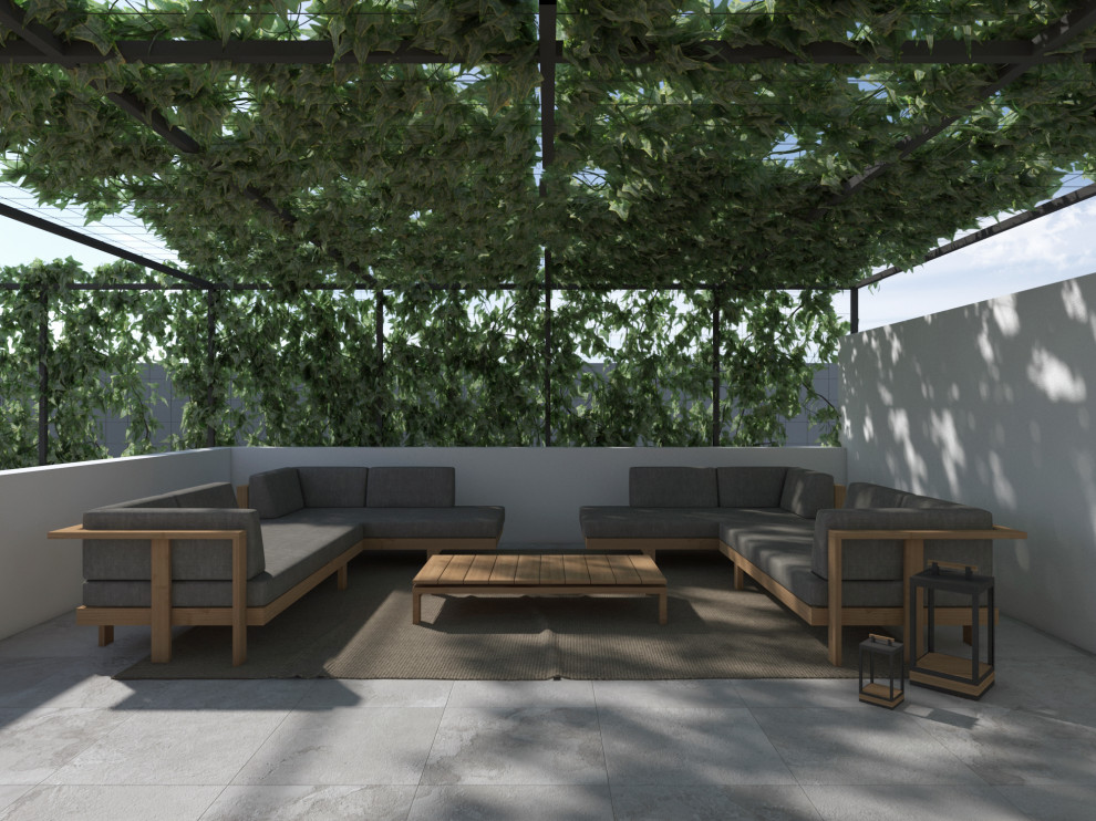Design ideas for a mid-sized contemporary rooftop deck in Catania-Palermo with a pergola.