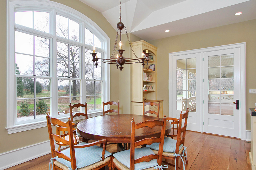 Design ideas for a traditional kitchen/dining combo in Philadelphia with beige walls and medium hardwood floors.