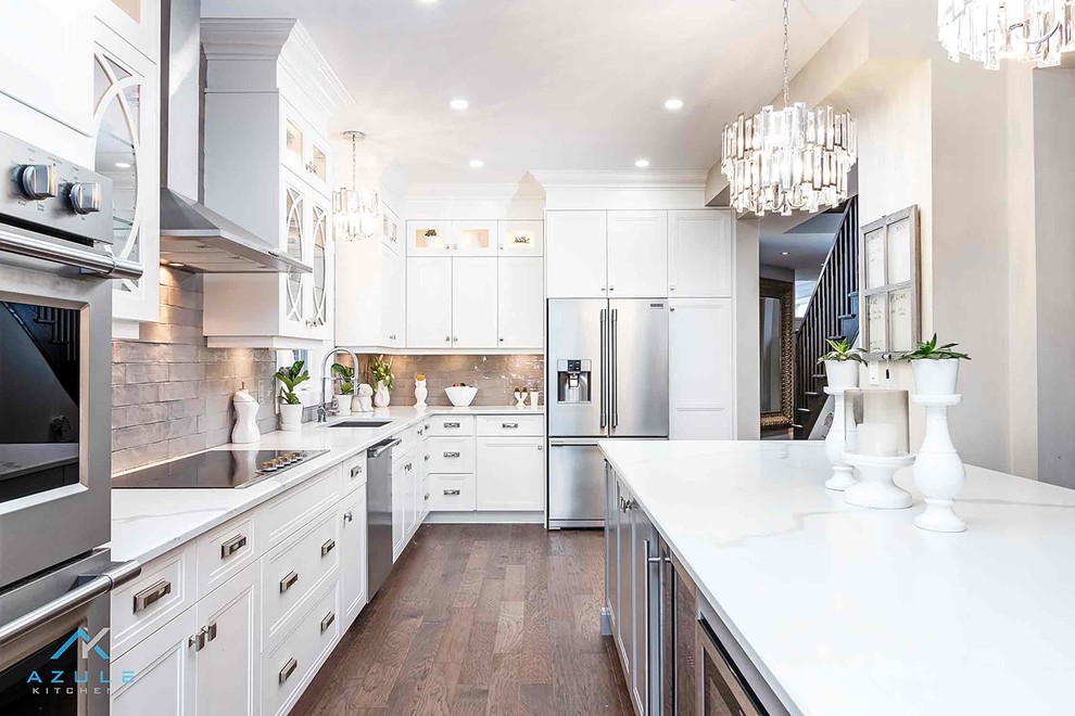 Eat-in kitchen - large transitional l-shaped eat-in kitchen idea with recessed-panel cabinets, white cabinets, quartz countertops, an island and white countertops
