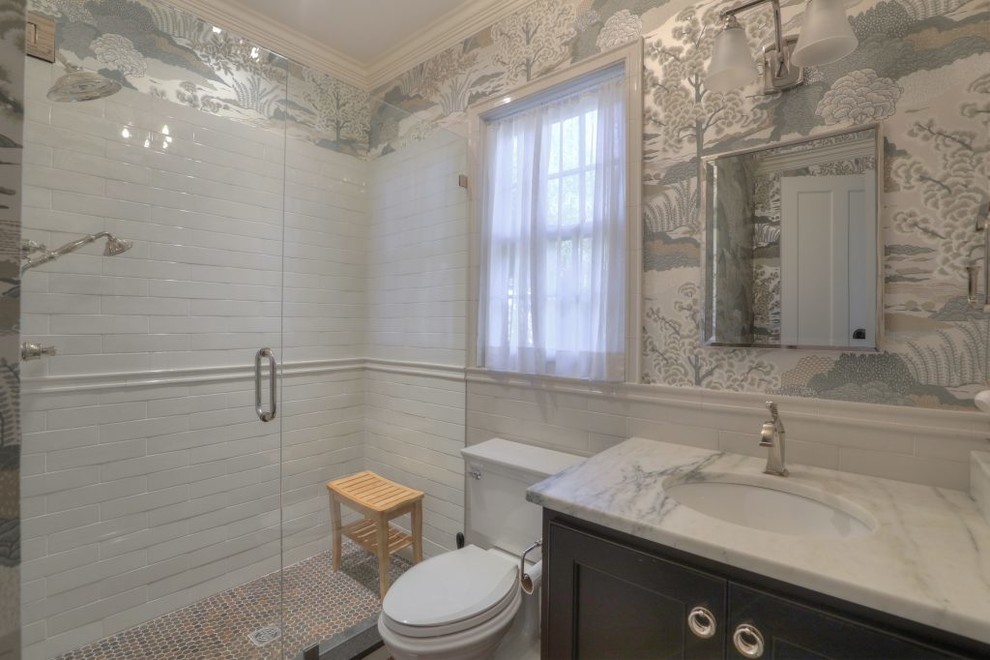 Design ideas for a small traditional 3/4 bathroom in Nashville with shaker cabinets, brown cabinets, an alcove shower, a two-piece toilet, white tile, ceramic tile, an undermount sink, marble benchtops and a hinged shower door.