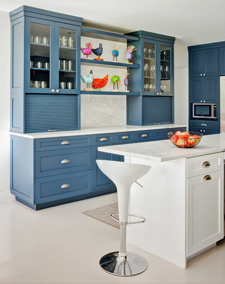Photo of a mid-sized traditional u-shaped eat-in kitchen in Chicago with shaker cabinets, blue cabinets, white splashback, stone slab splashback, with island, marble benchtops, stainless steel appliances and vinyl floors.