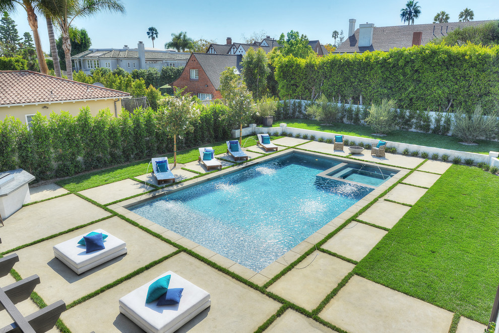 Design ideas for a mid-sized modern backyard rectangular pool in Los Angeles with a hot tub and concrete pavers.