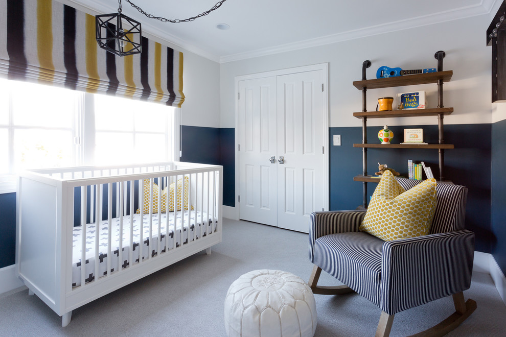 Inspiration for a mid-sized transitional nursery for boys in Orange County with blue walls and carpet.