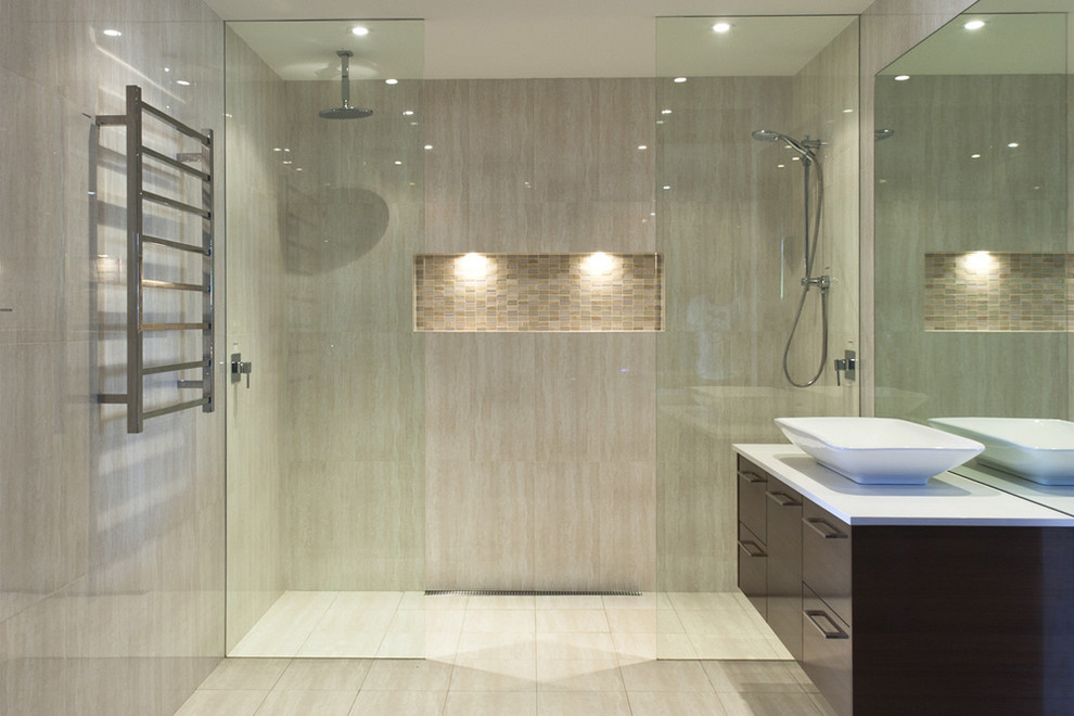 Design ideas for a mid-sized modern master bathroom in San Francisco with flat-panel cabinets, dark wood cabinets, a curbless shower, beige tile and a vessel sink.