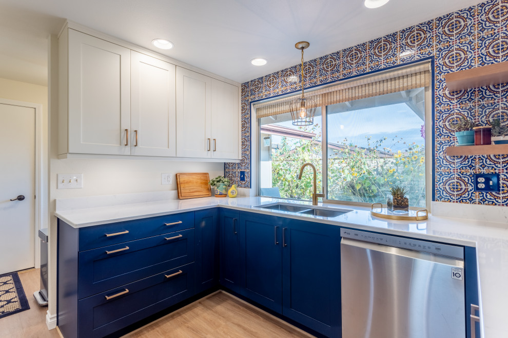 Design ideas for a mid-sized transitional kitchen in Seattle with shaker cabinets, blue cabinets, quartz benchtops, ceramic splashback and white benchtop.