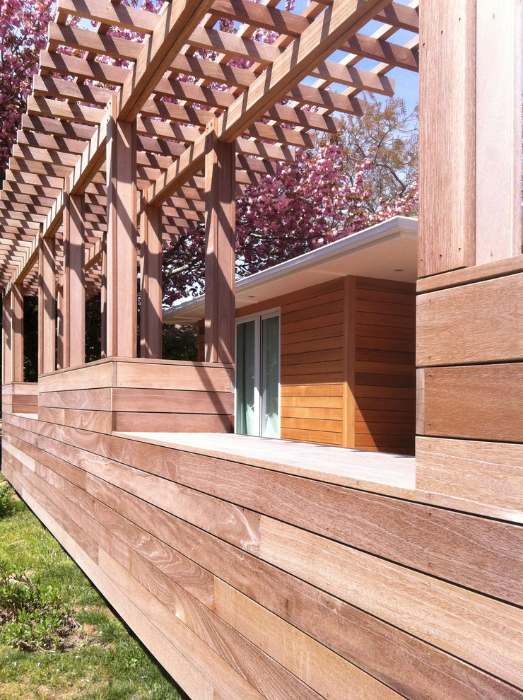 This is an example of a mid-sized contemporary one-storey exterior in New York with wood siding.