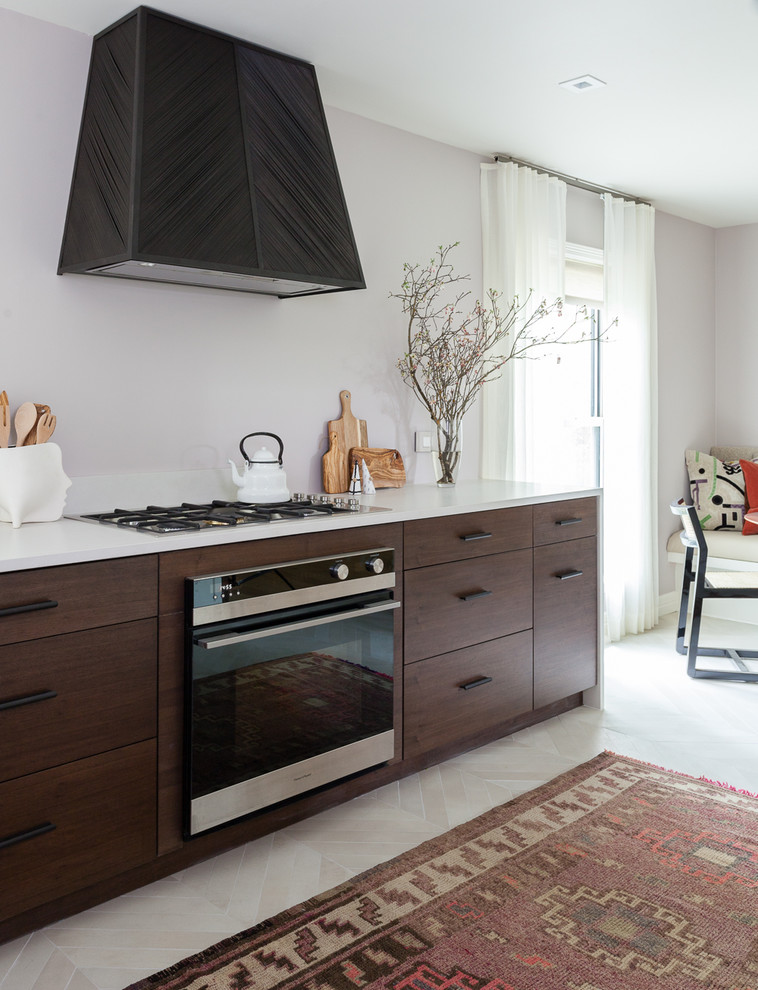 Example of a mid-sized eclectic galley porcelain tile and beige floor eat-in kitchen design in Austin with a double-bowl sink, flat-panel cabinets, dark wood cabinets, quartz countertops, stainless steel appliances and no island