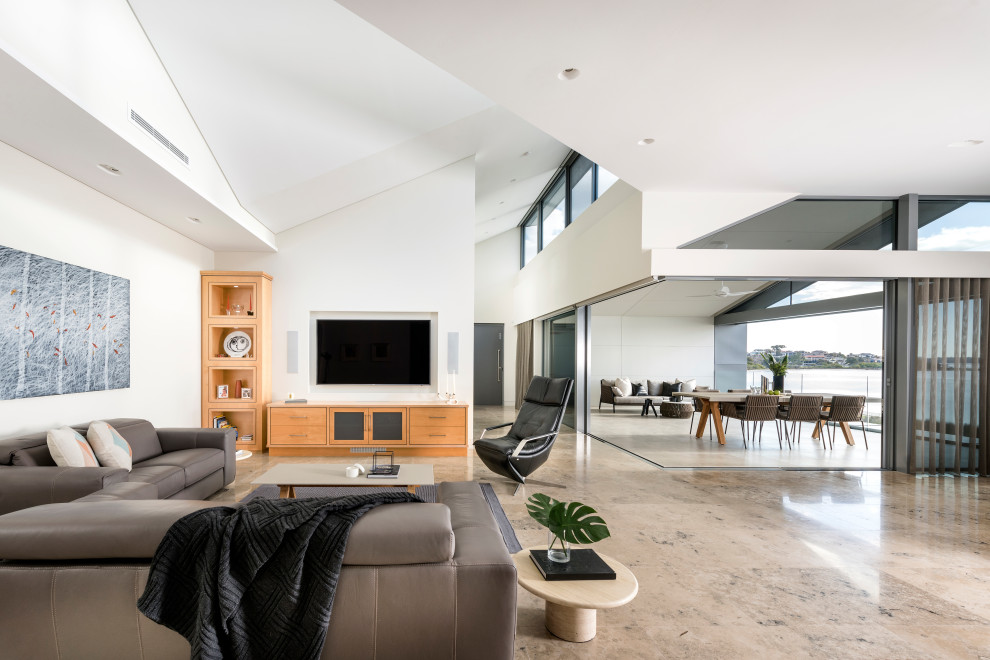 Design ideas for a contemporary open concept living room in Perth with white walls, no fireplace, a wall-mounted tv and brown floor.