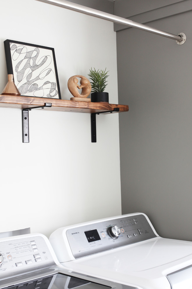 Home design - small transitional dark wood floor and brown floor home design idea in Chicago with gray cabinets, wood countertops and a side-by-side washer/dryer