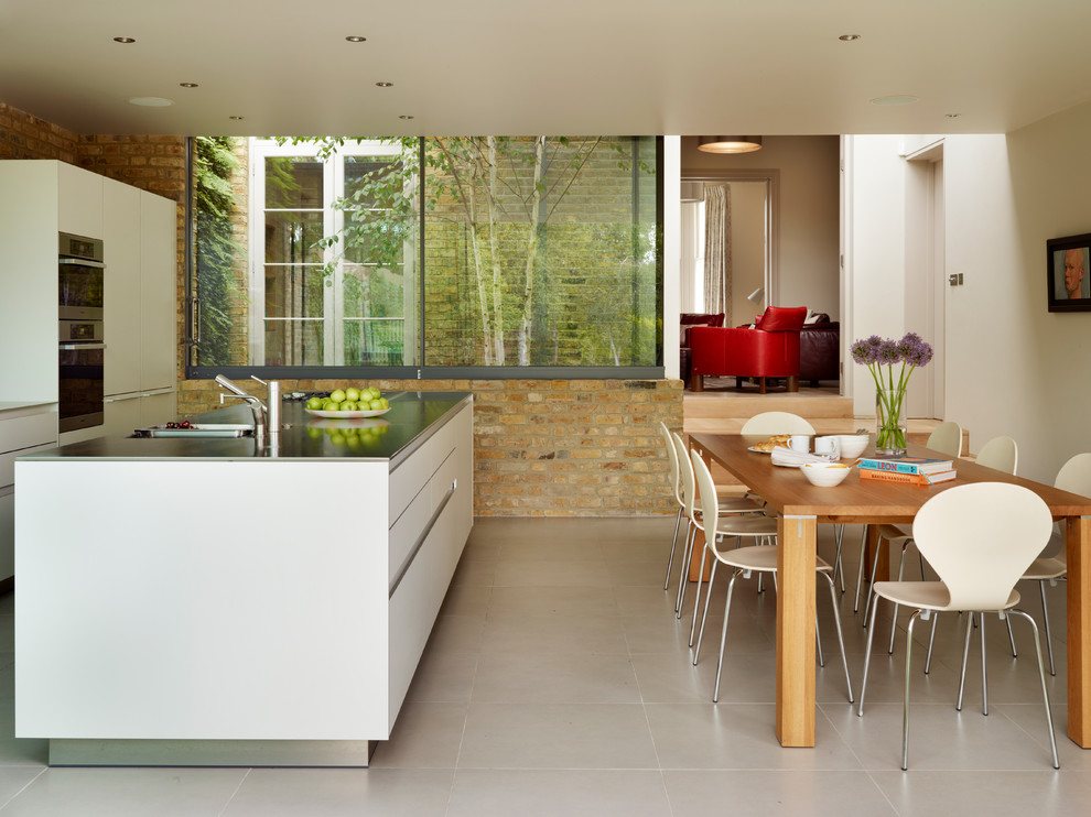 This is an example of a contemporary kitchen in Cheshire with an island.
