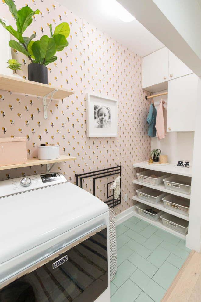 Photo of a small eclectic single-wall laundry cupboard in Houston with ceramic floors and green floor.