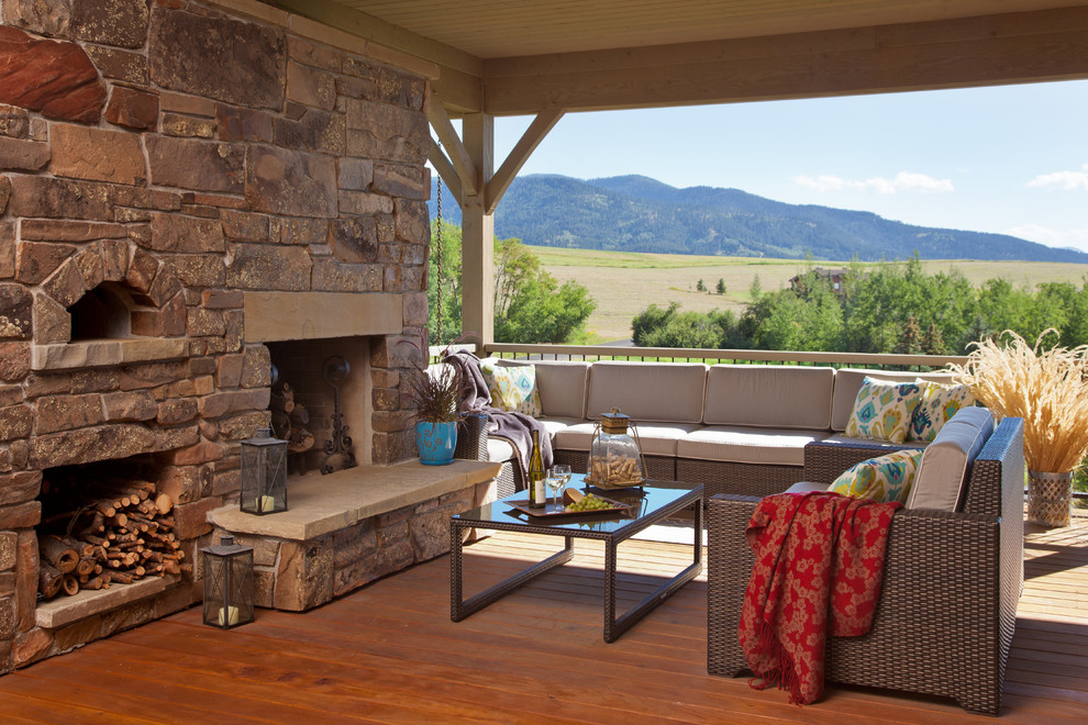 Design ideas for a country deck in Other with a fire feature.