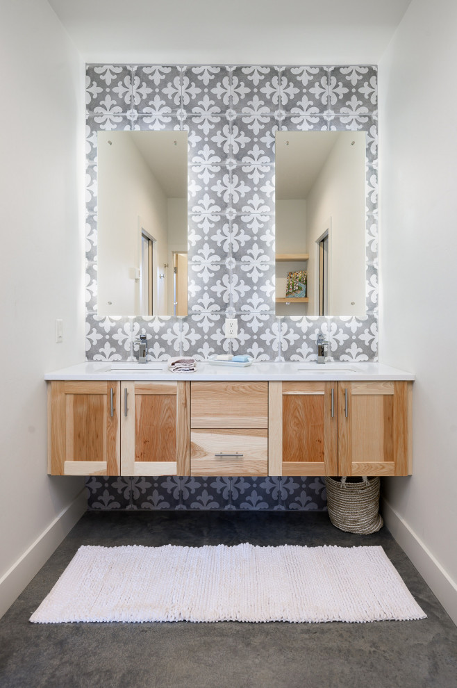 Photo of a scandi family bathroom in Other with recessed-panel cabinets, light wood cabinets, white walls, concrete flooring, a submerged sink, white worktops, double sinks and a built in vanity unit.