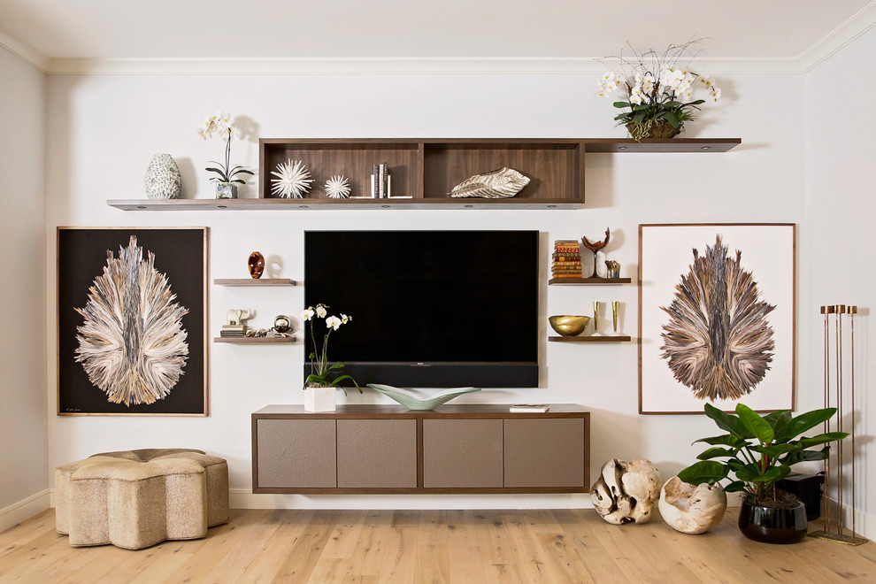 Family room - coastal light wood floor and brown floor family room idea in Miami with white walls and a wall-mounted tv
