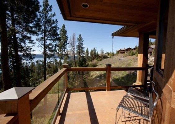 Deck - large rustic deck idea in Seattle with a roof extension